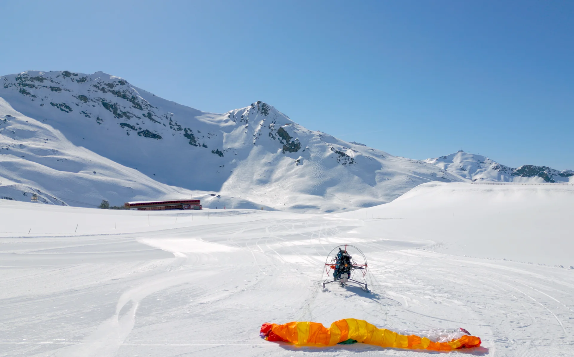 Snow trike above mountain ridge
